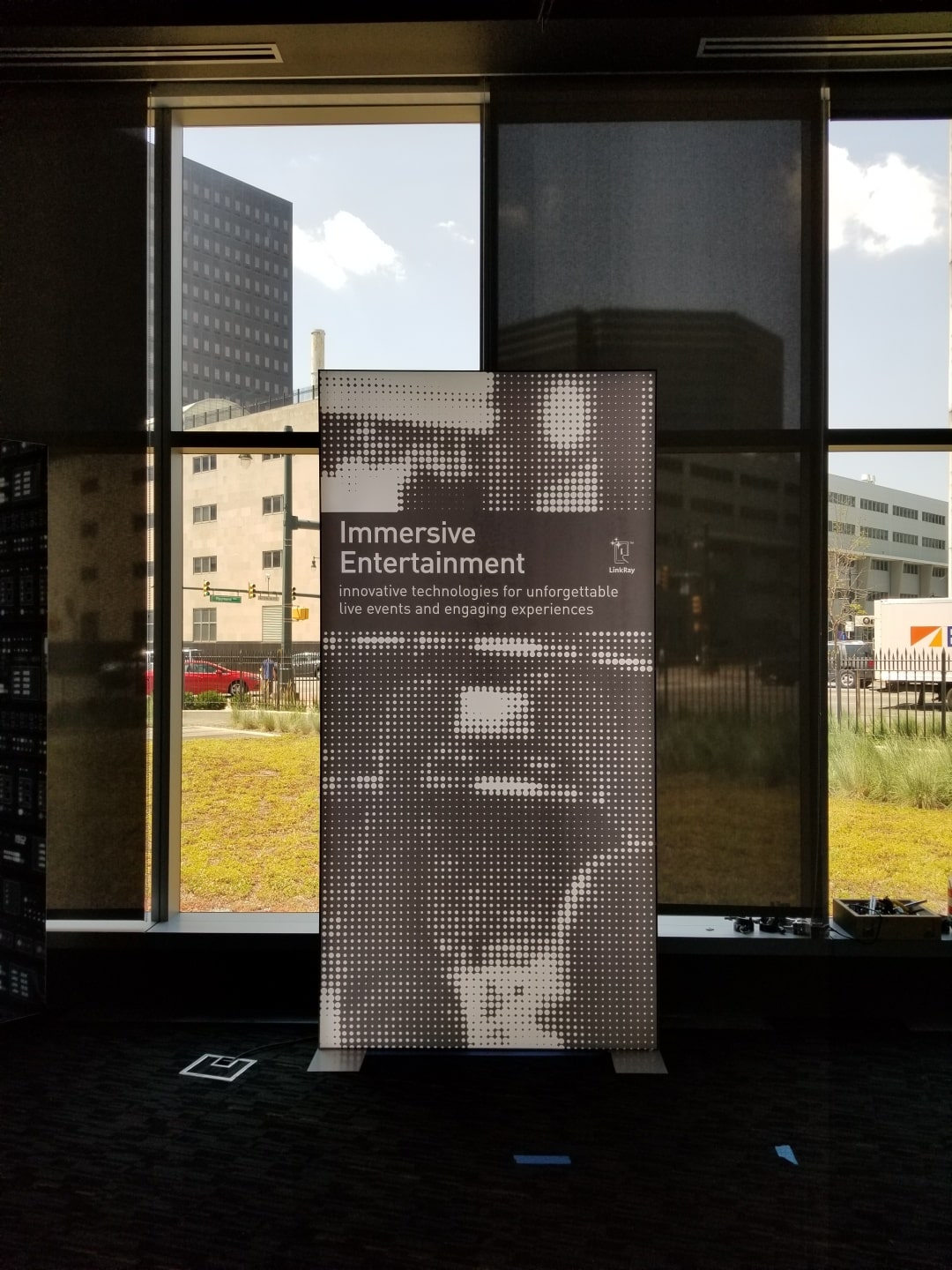 An image of a poster in front of a window.