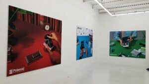 A room with several paintings on the wall.