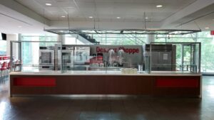 A large kitchen counter with red and white accents.